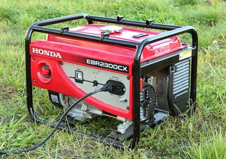 A Honda portable generator connected to a power cord